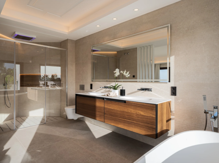 Bathroom with double vanity and glass shower
