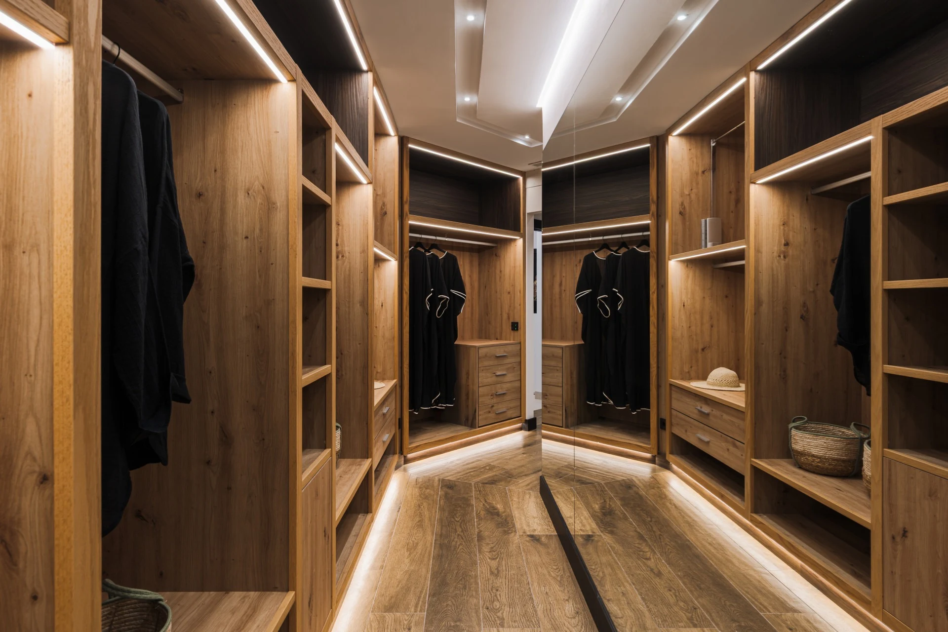 Dressing room with illuminated fitted wardrobes