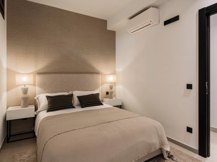 Lower-level guest bedroom with neutral finishes