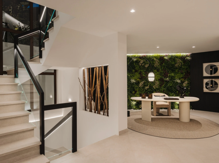 Entrance hall with staircase and garden outlook