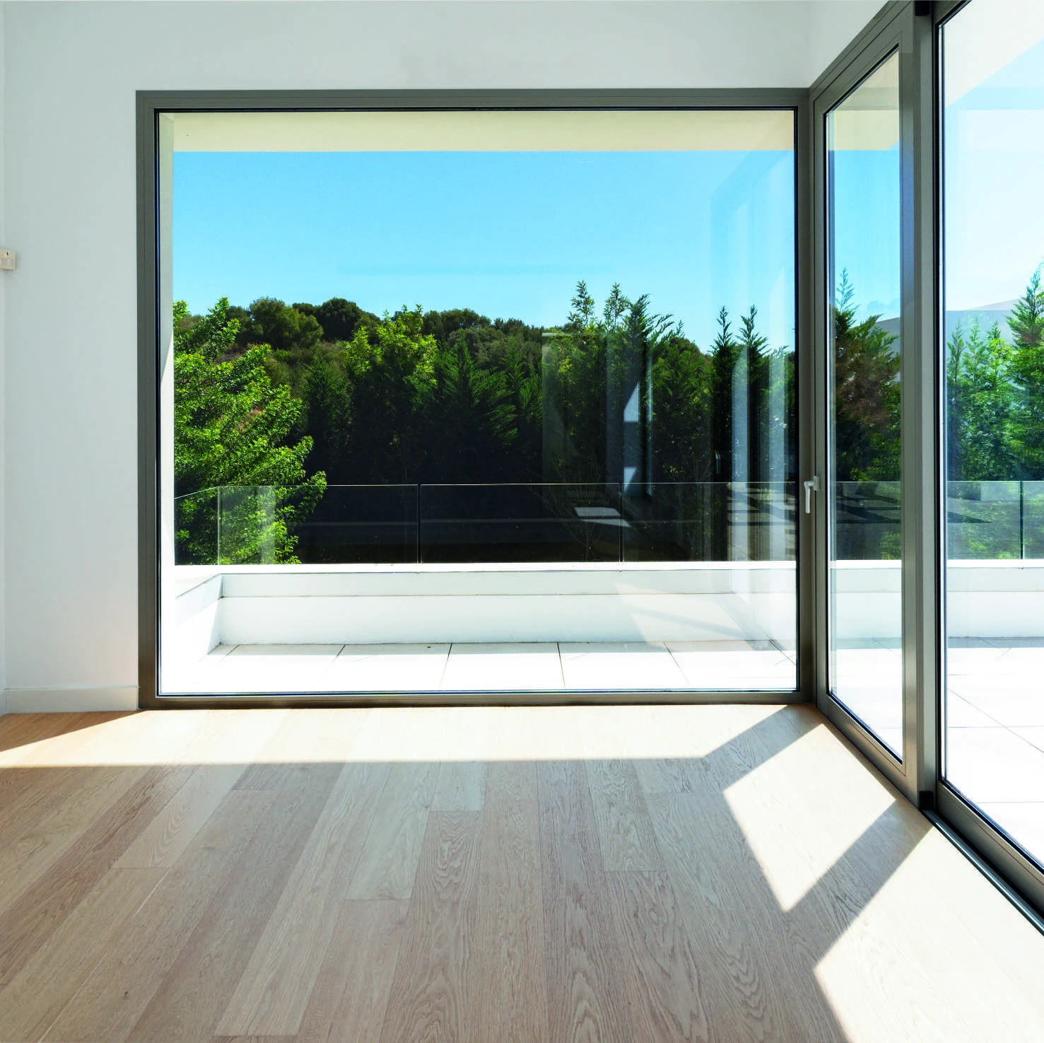 Bedroom window overlooking mature greenery in El Paraiso