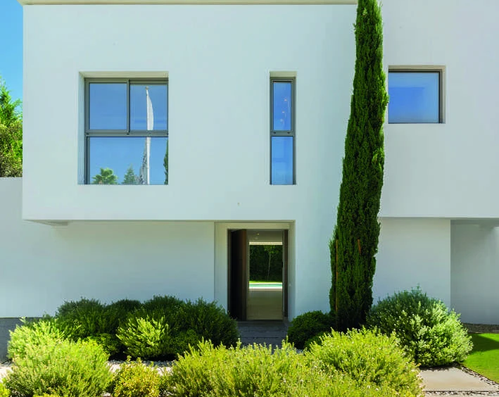 Entrance facade of a contemporary villa in El Paraiso