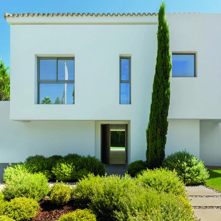 Entrance facade of a contemporary villa in El Paraiso