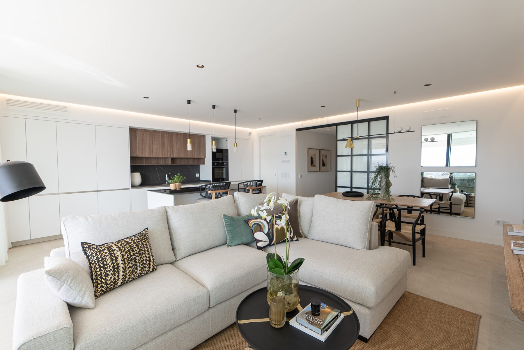 Representative show-home living room and open kitchen