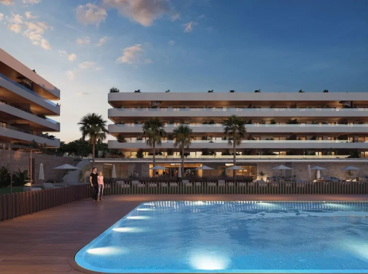 Illustrative communal pool and residences at dusk