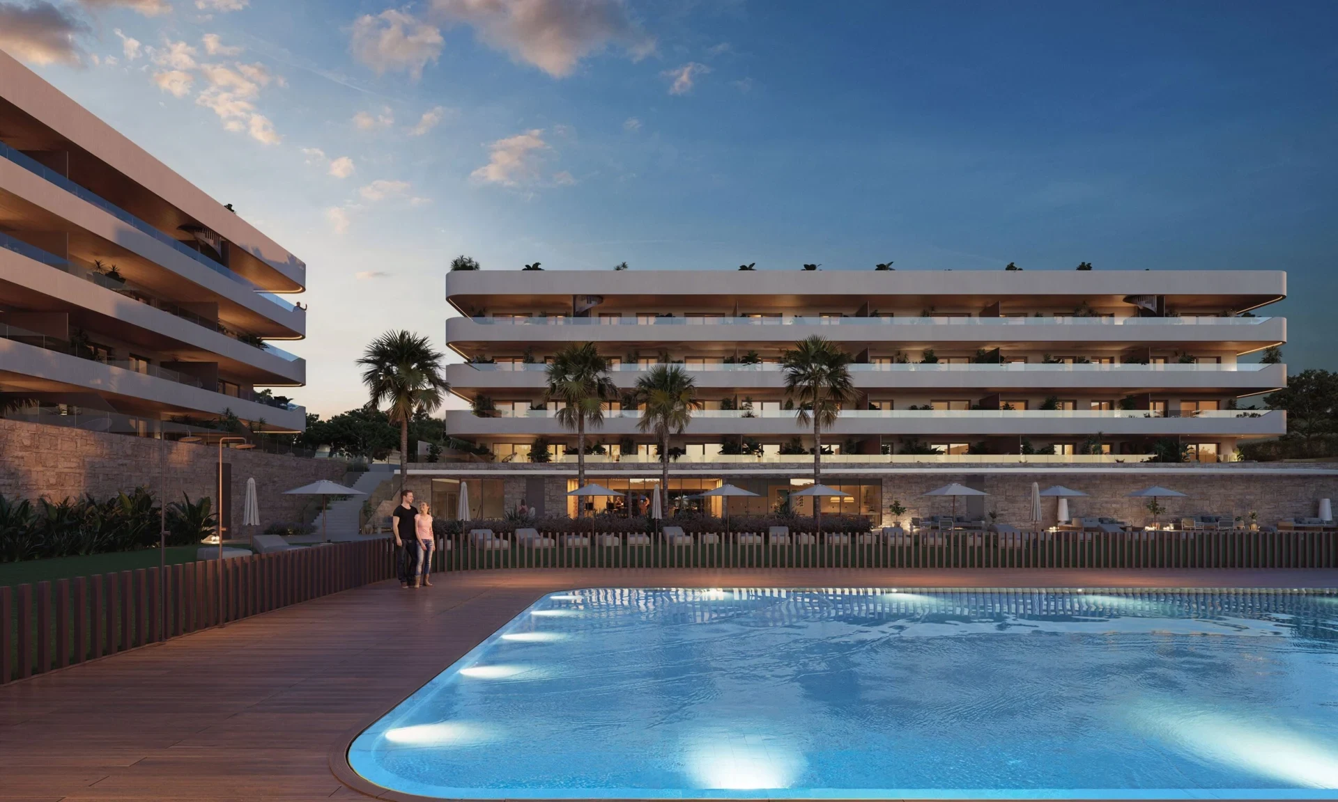 Illustrative communal pool and residences at dusk
