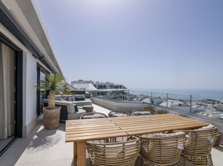 Representative outdoor dining area on a penthouse terrace