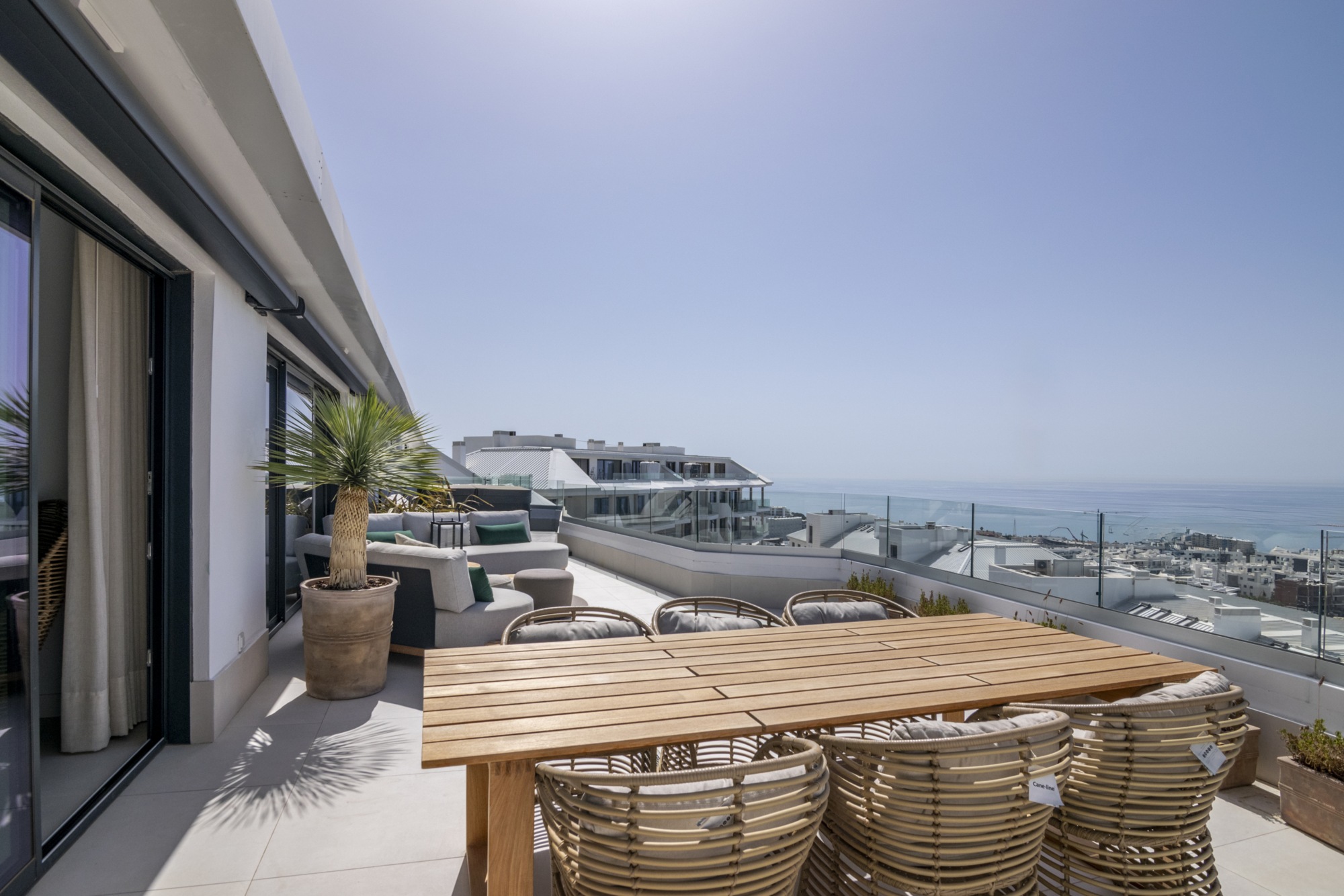 Representative outdoor dining area on a penthouse terrace