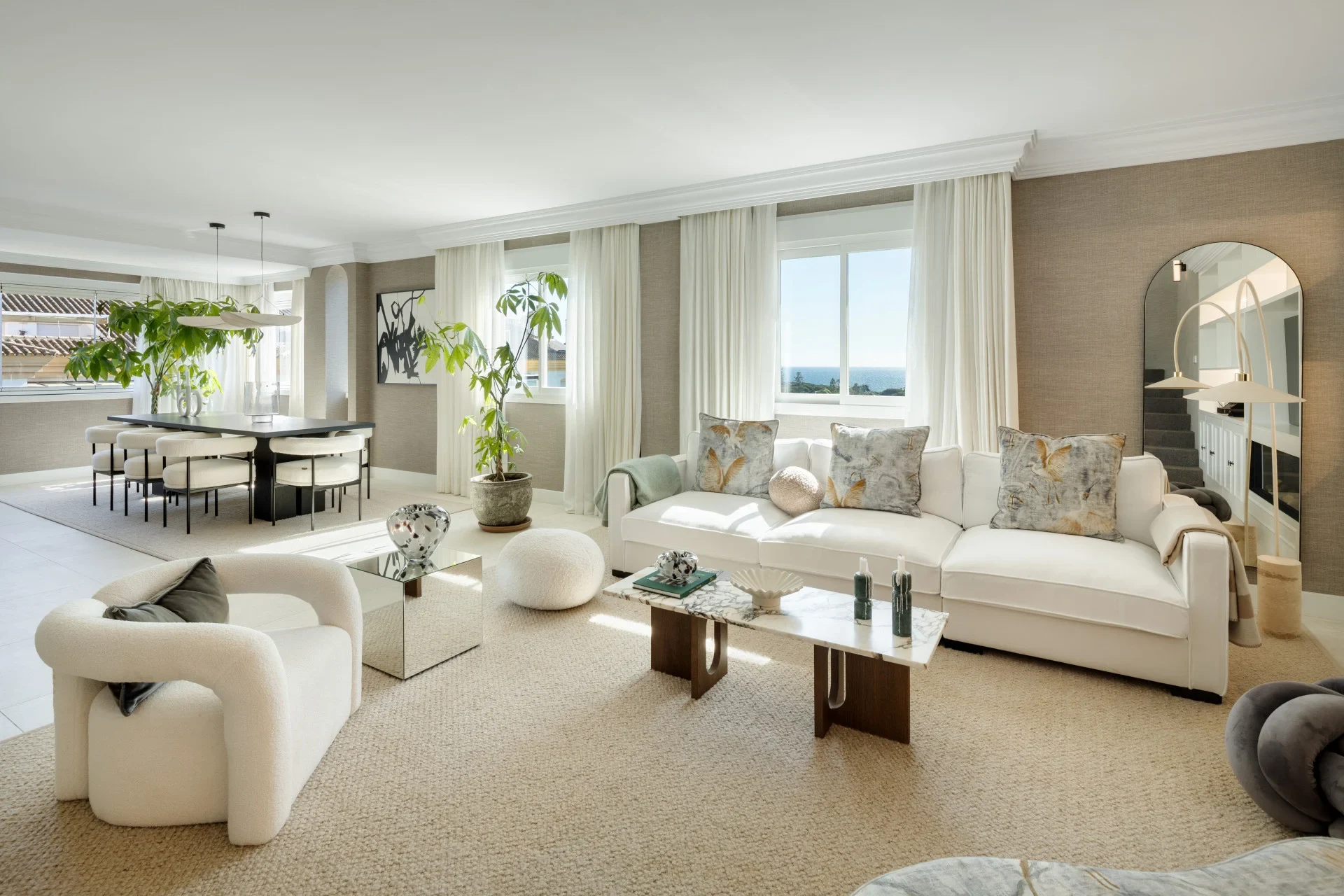 Open-plan living room with large windows