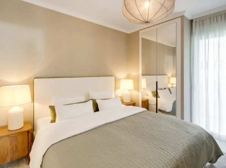 Double bedroom with soft neutral finishes