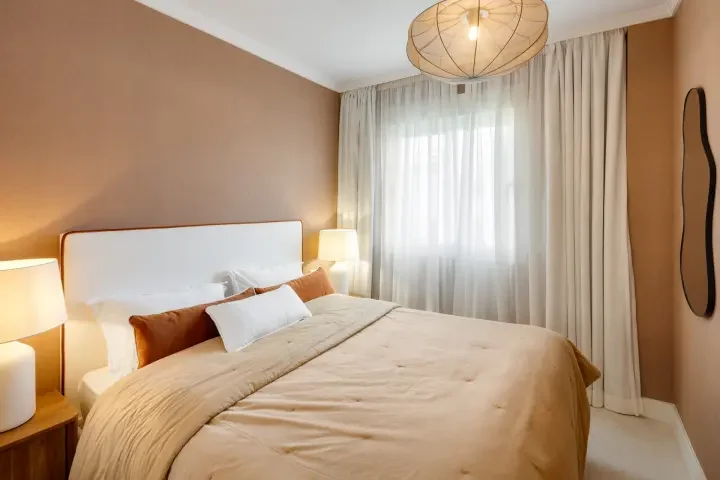 Guest bedroom with large windows