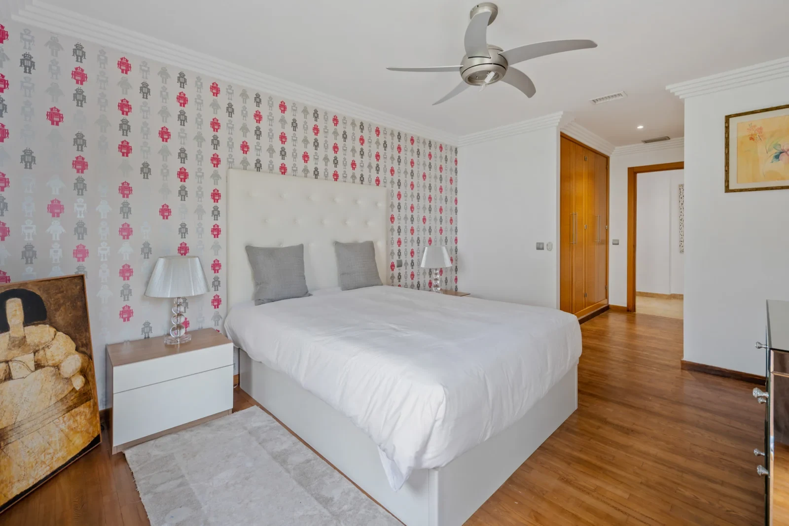 Additional bedroom with patterned wallpaper
