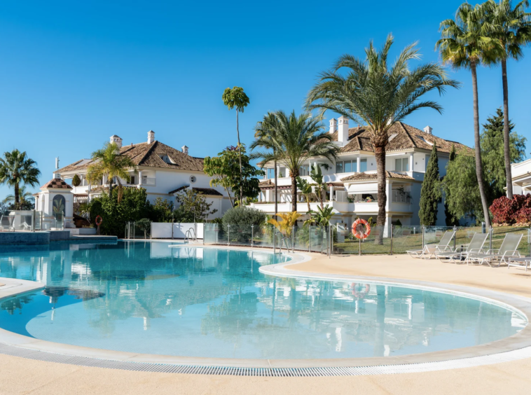 Communal outdoor swimming pool and gardens