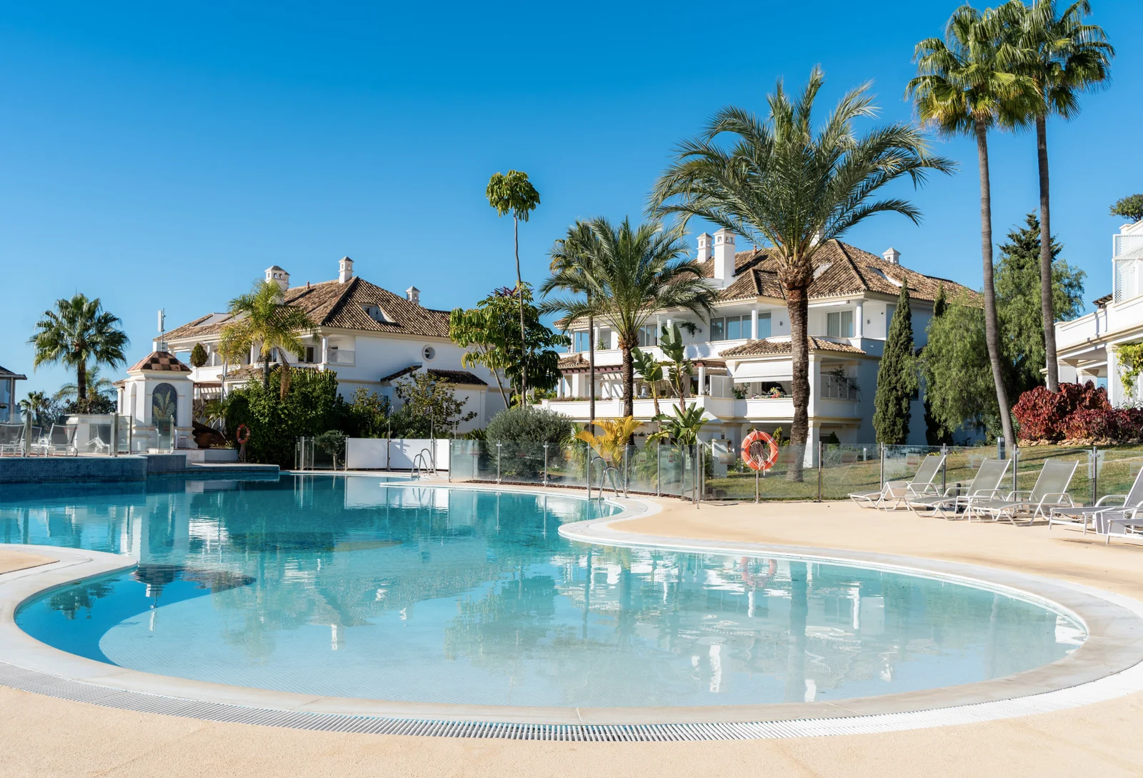 Communal outdoor swimming pool and gardens