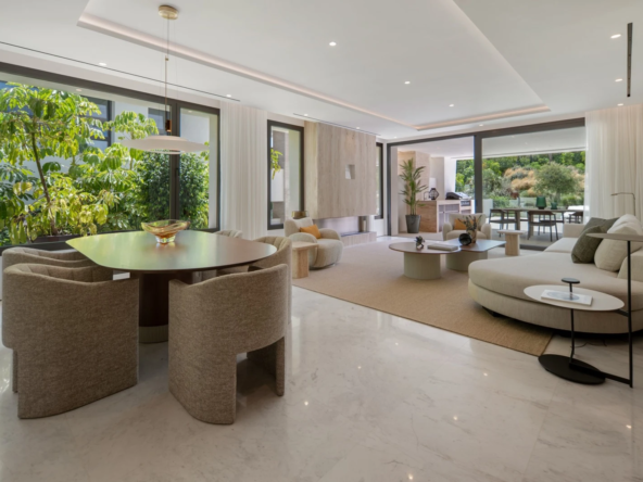Bright living and dining space opening onto the terrace on the Golden Mile