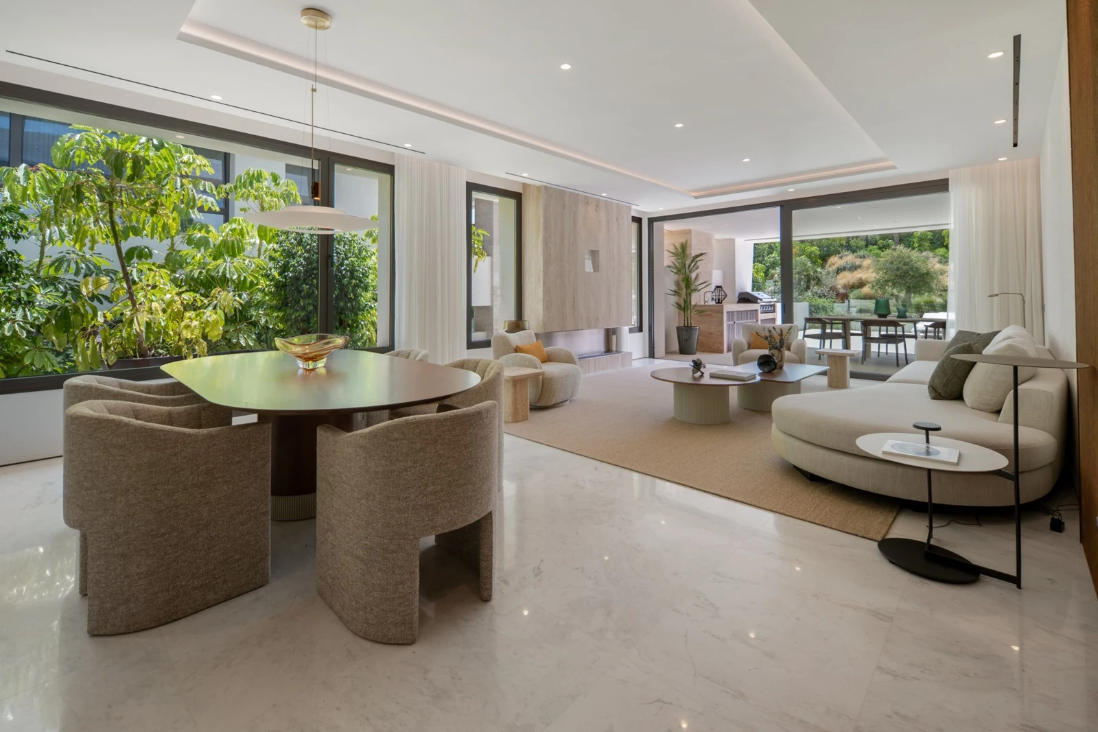Bright living and dining space opening onto the terrace on the Golden Mile