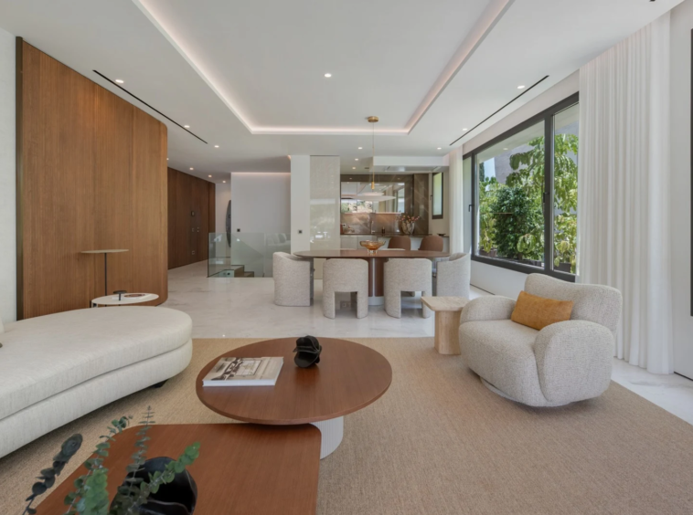 Living room with large windows and contemporary furnishings