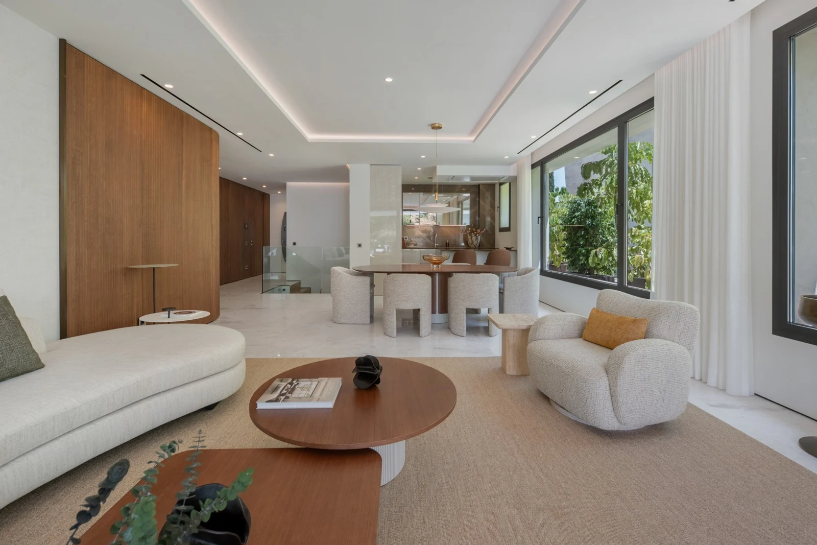 Living room with large windows and contemporary furnishings