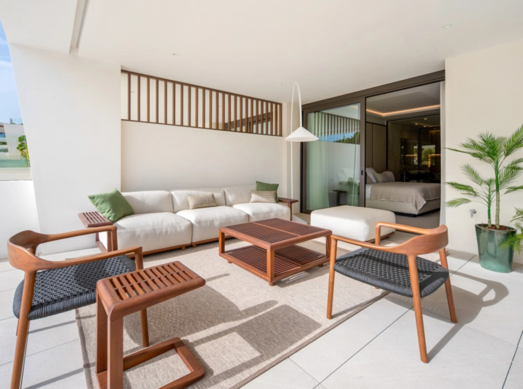Private terrace seating beside the apartment