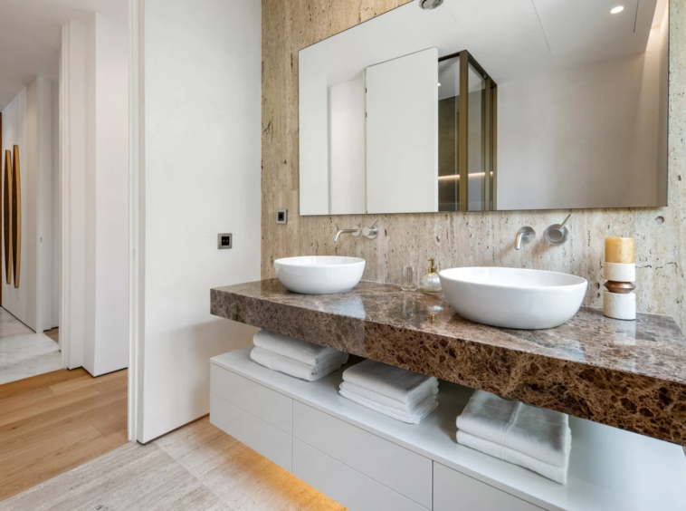 Guest bathroom with stone vanity and walk-in shower