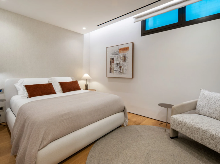 Bedroom on the basement level with a high window