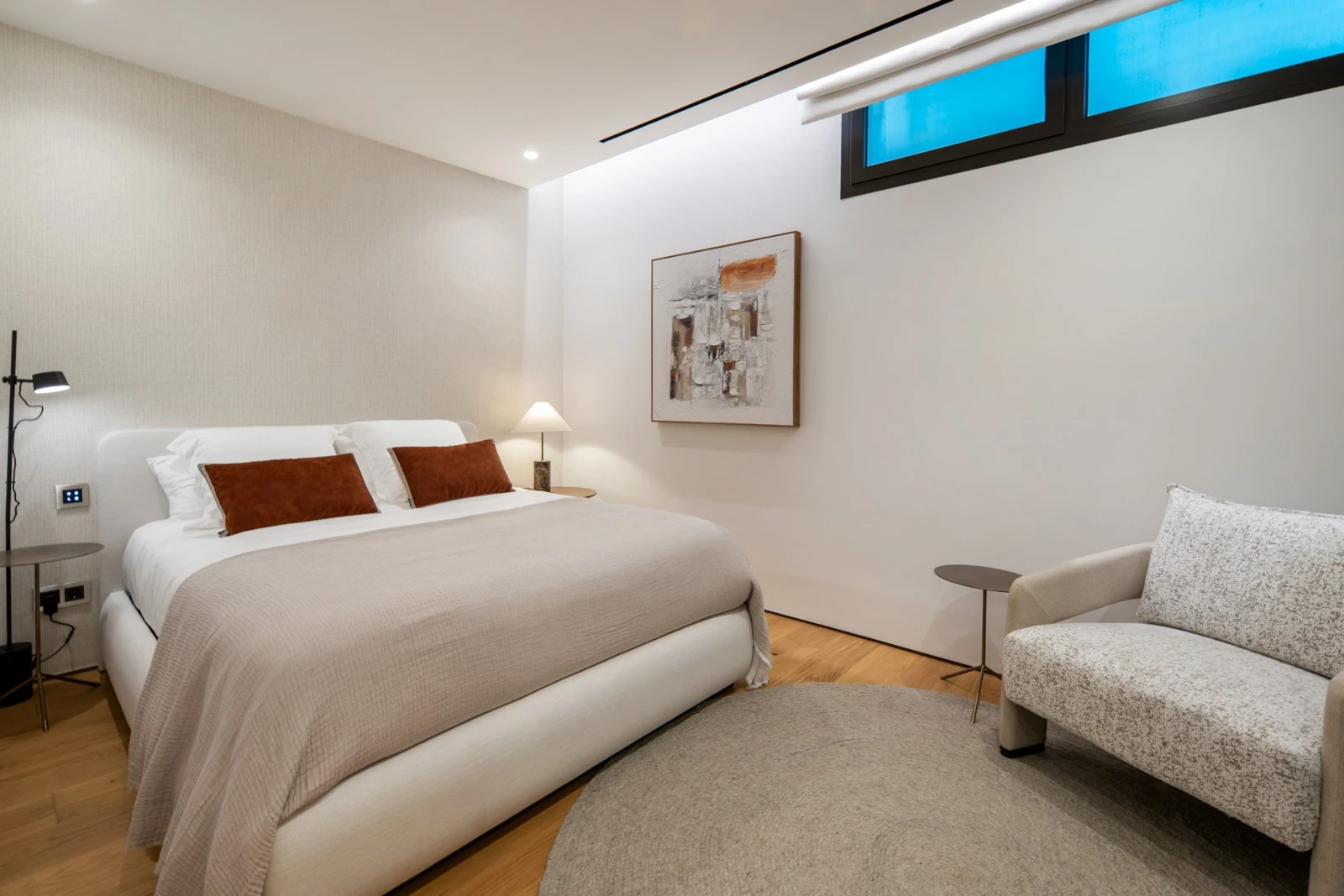 Bedroom on the basement level with a high window