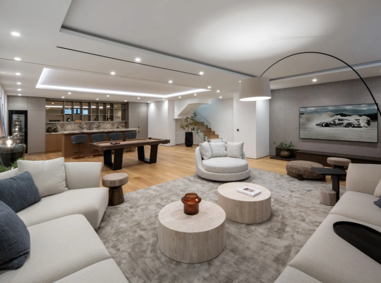 Lower-level lounge with seating and games area