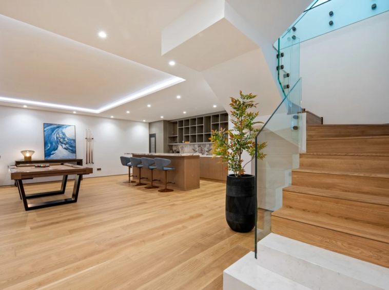 Staircase connecting the lower lounge and main living level