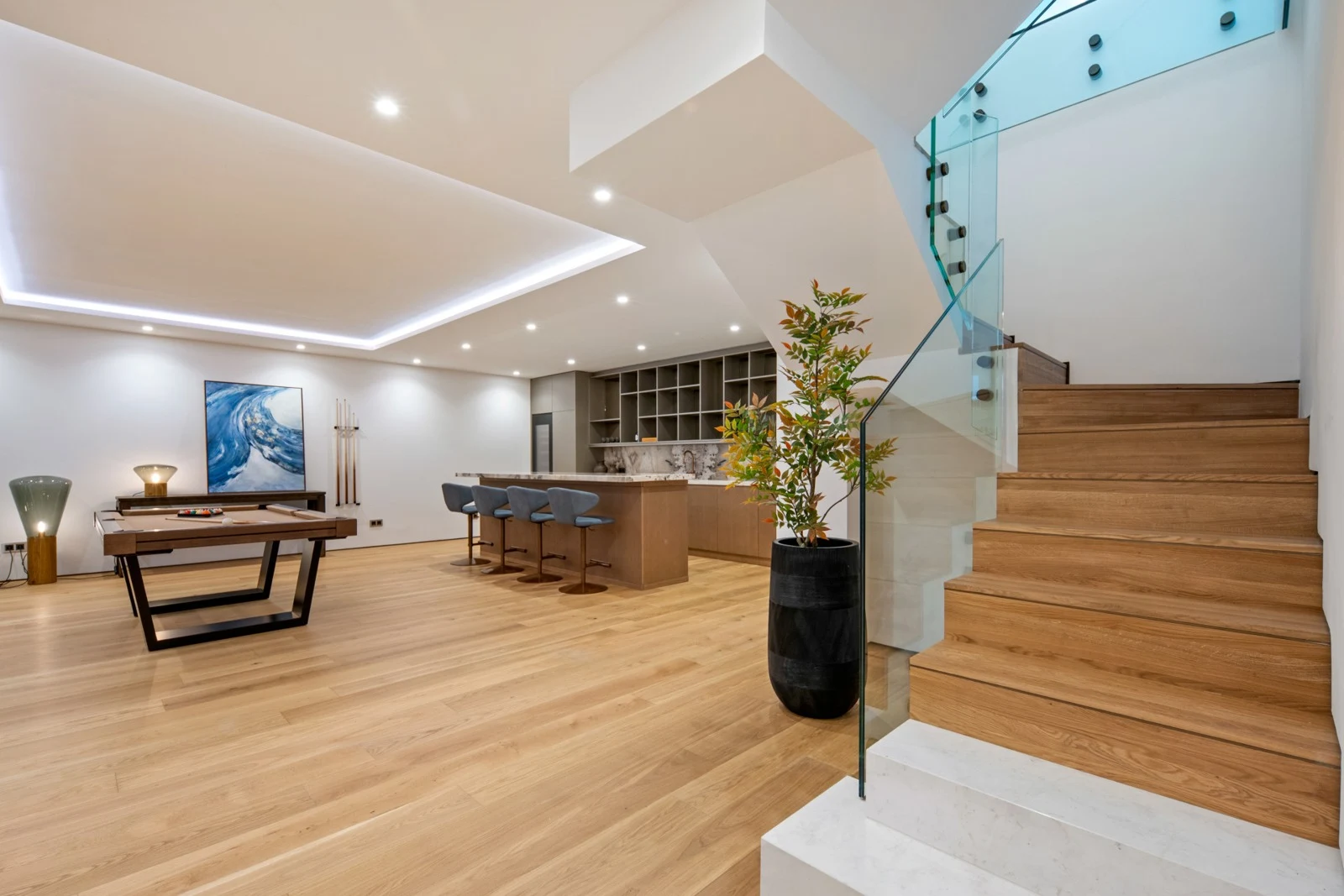Staircase connecting the lower lounge and main living level