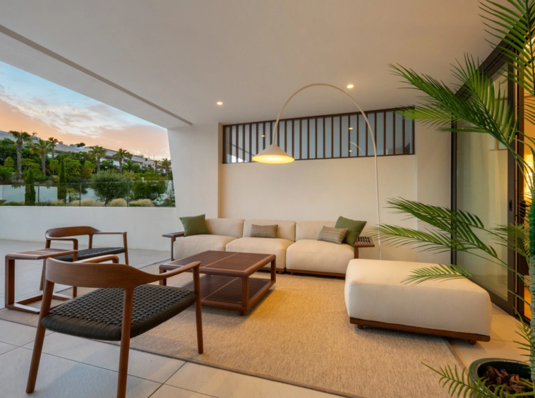 Private covered terrace seating at dusk