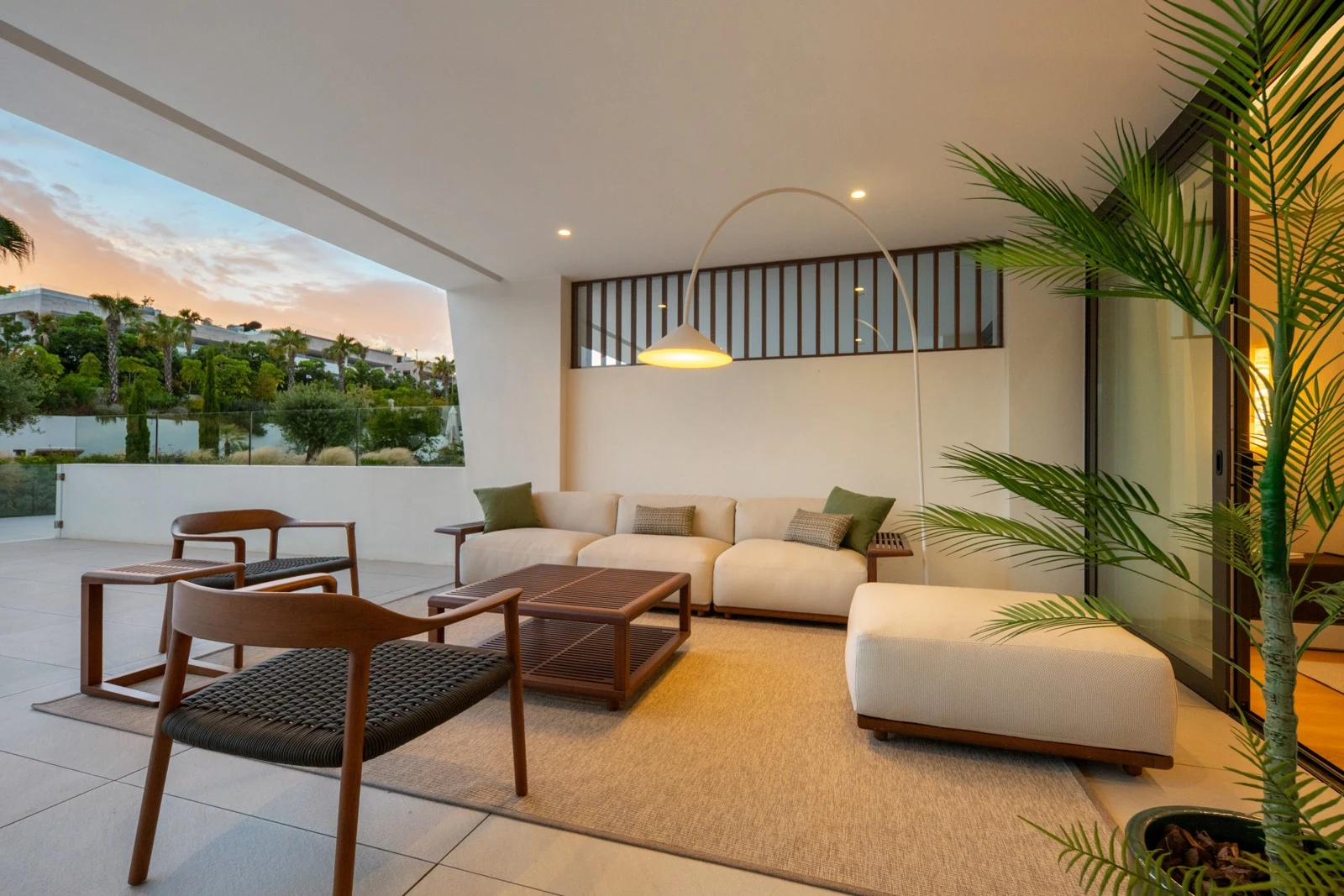 Private covered terrace seating at dusk