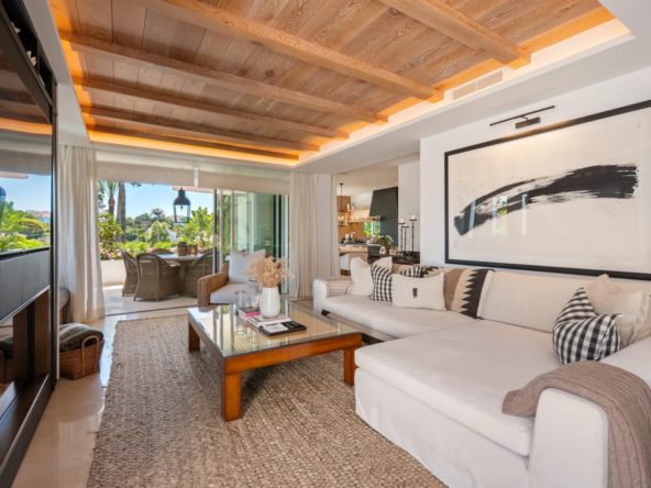 Living room with wood ceiling and terrace doors on Marbella’s Golden Mile