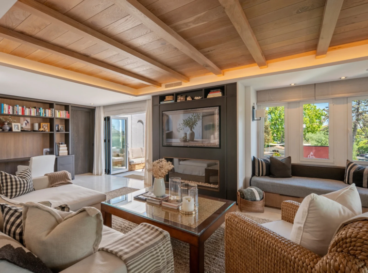 Living room with shelving and fireplace on Marbella’s Golden Mile