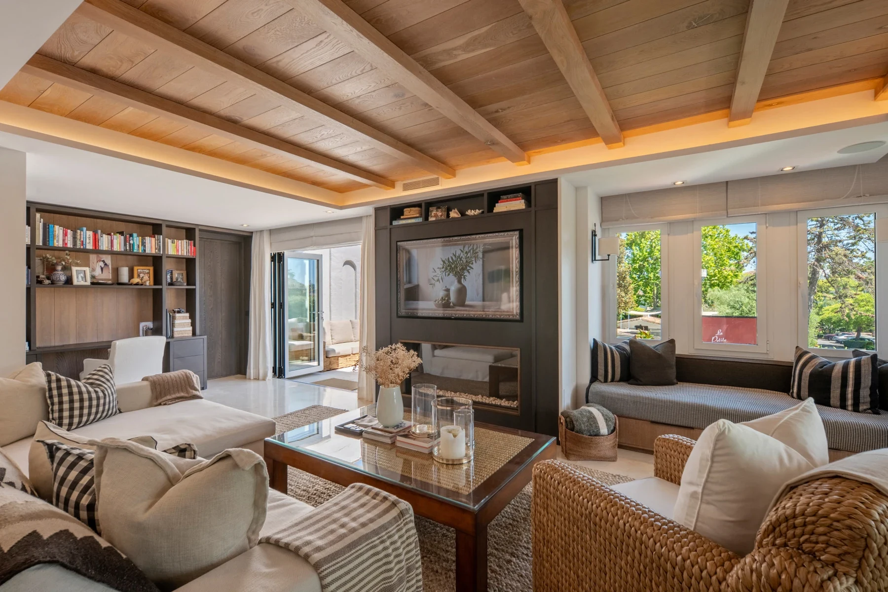 Living room with shelving and fireplace on Marbella’s Golden Mile