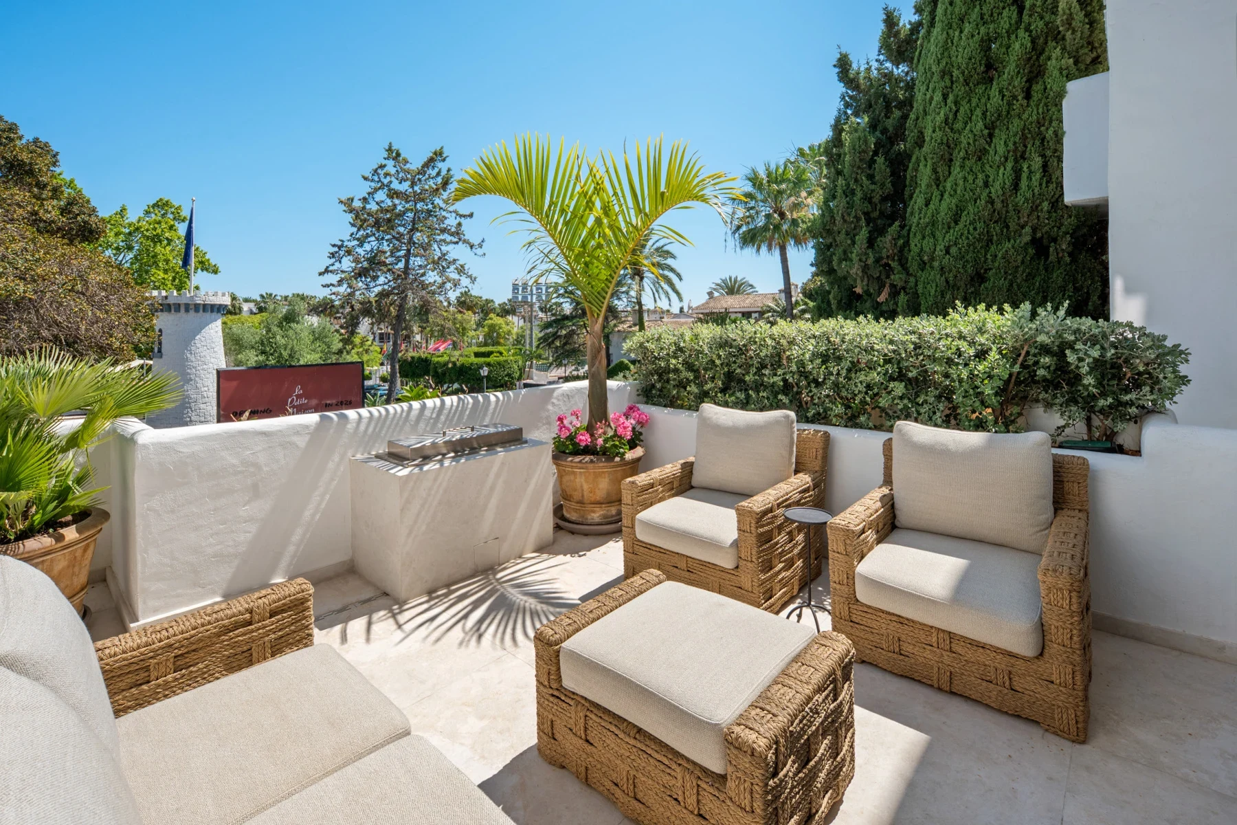 Terrace seating with mature planting on Marbella’s Golden Mile