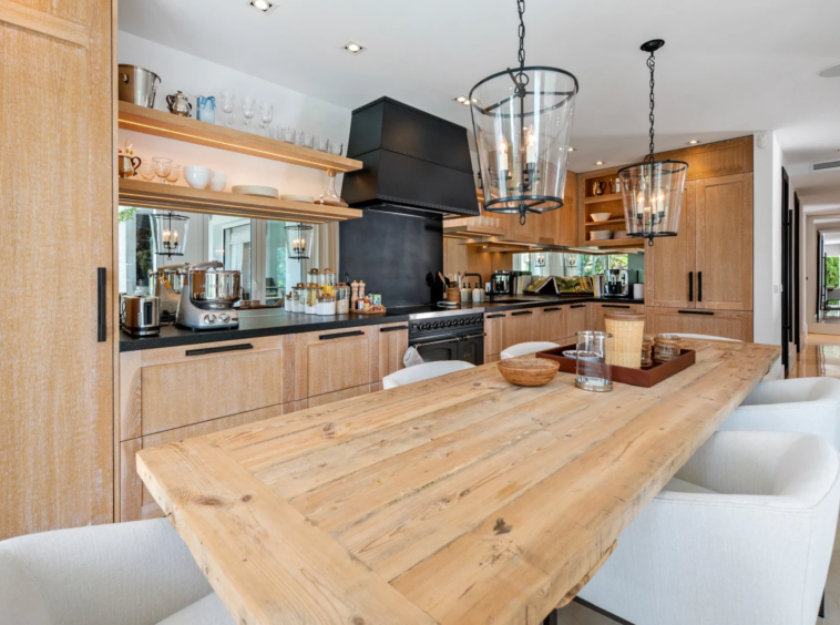 Kitchen with dining island and wood finishes on Marbella’s Golden Mile