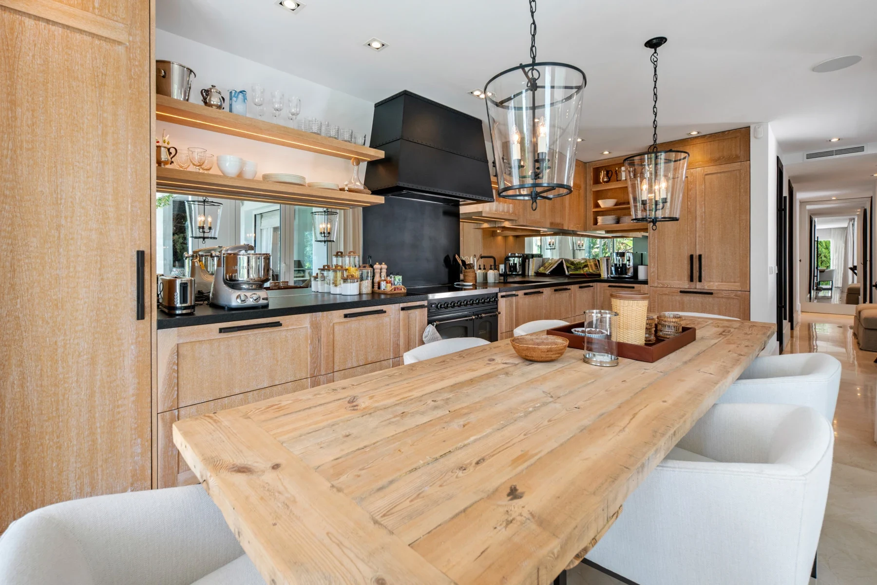 Kitchen with dining island and wood finishes on Marbella’s Golden Mile