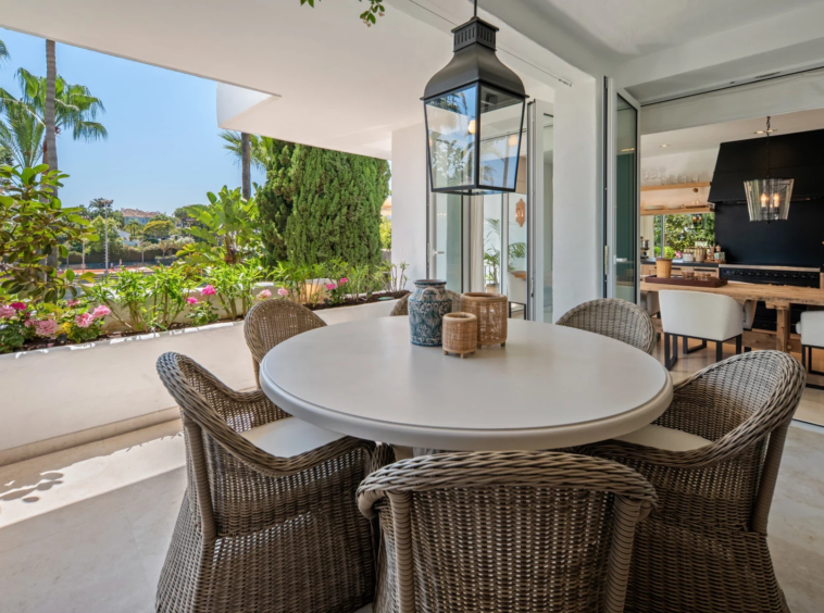 Terrace overlooking landscaped communal grounds on Marbella’s Golden Mile