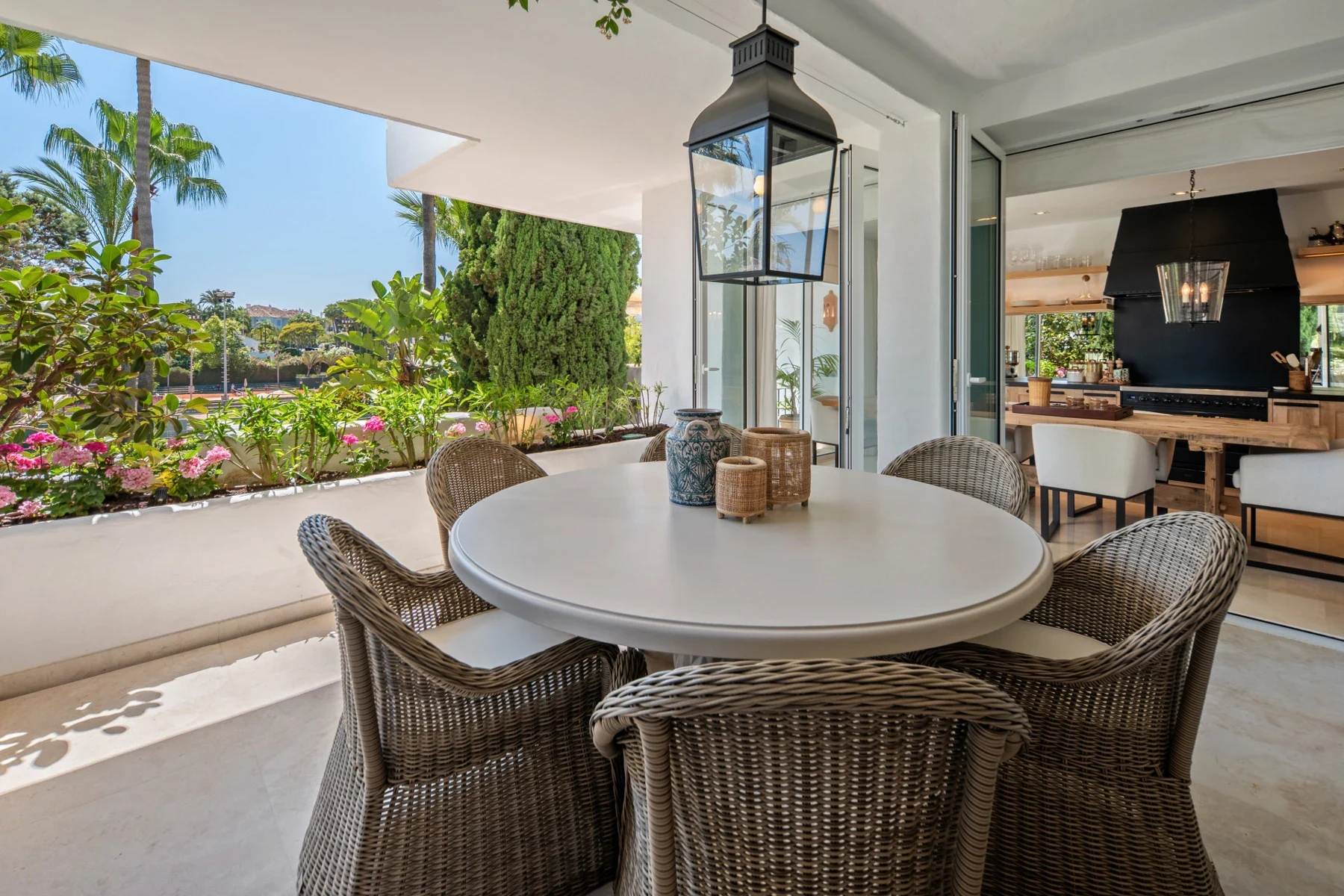 Terrace overlooking landscaped communal grounds on Marbella’s Golden Mile