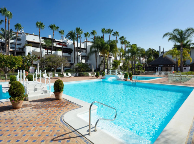 Communal swimming pool and landscaped grounds on Marbella’s Golden Mile