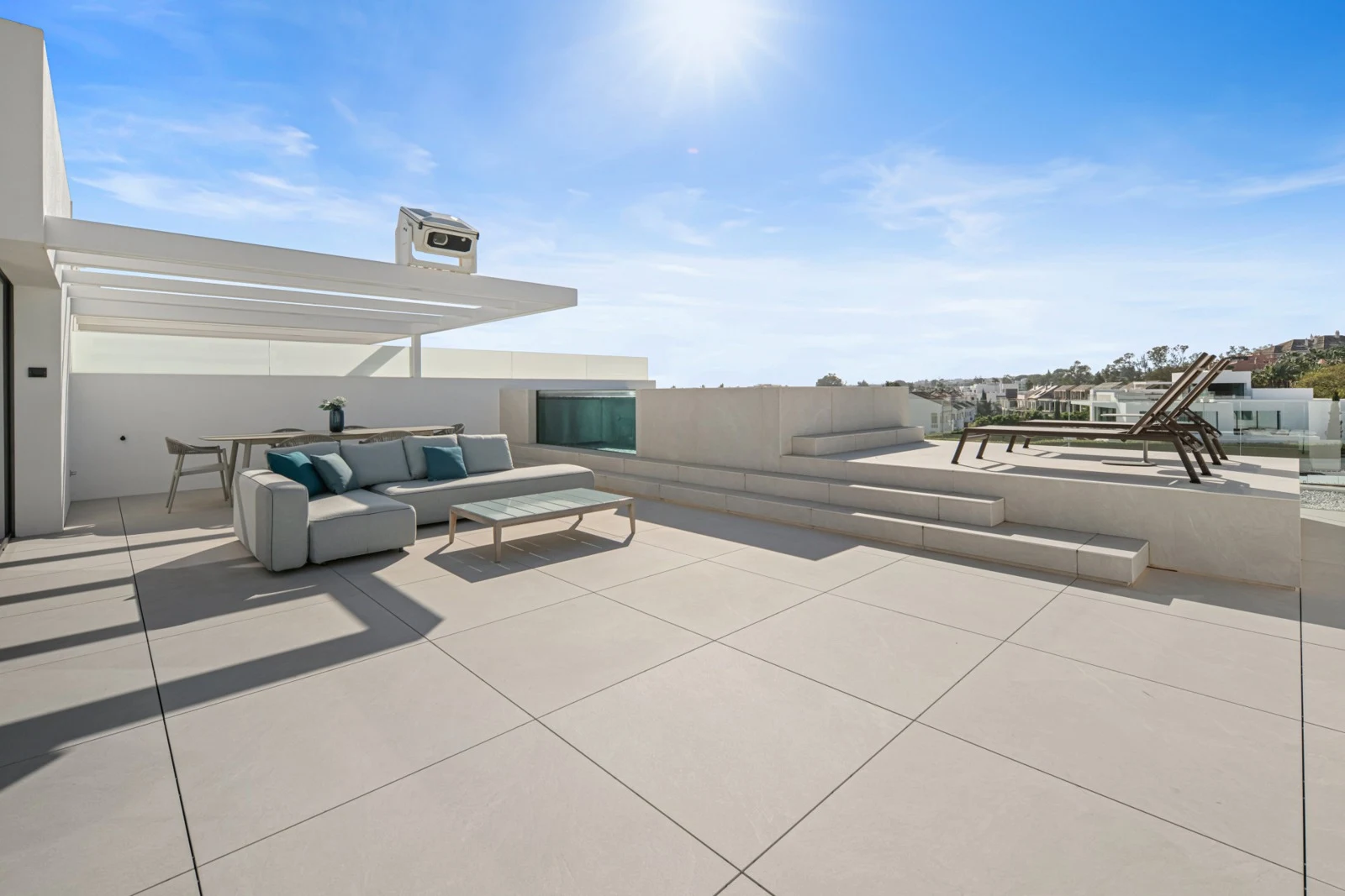 Spacious rooftop terrace with lounge seating