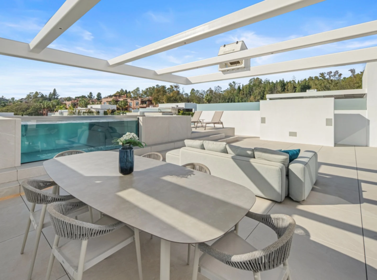 Rooftop pergola and seating beside the private pool