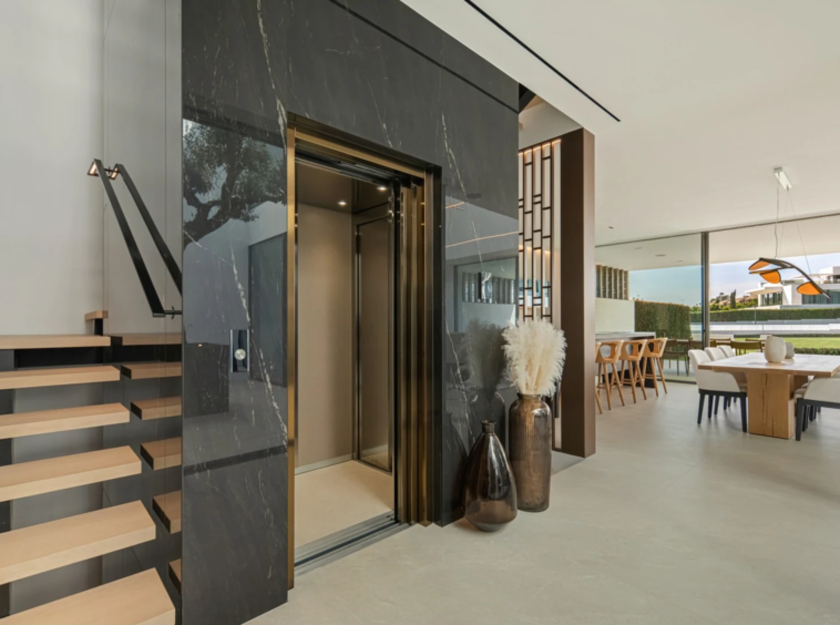 Private lift beside the staircase