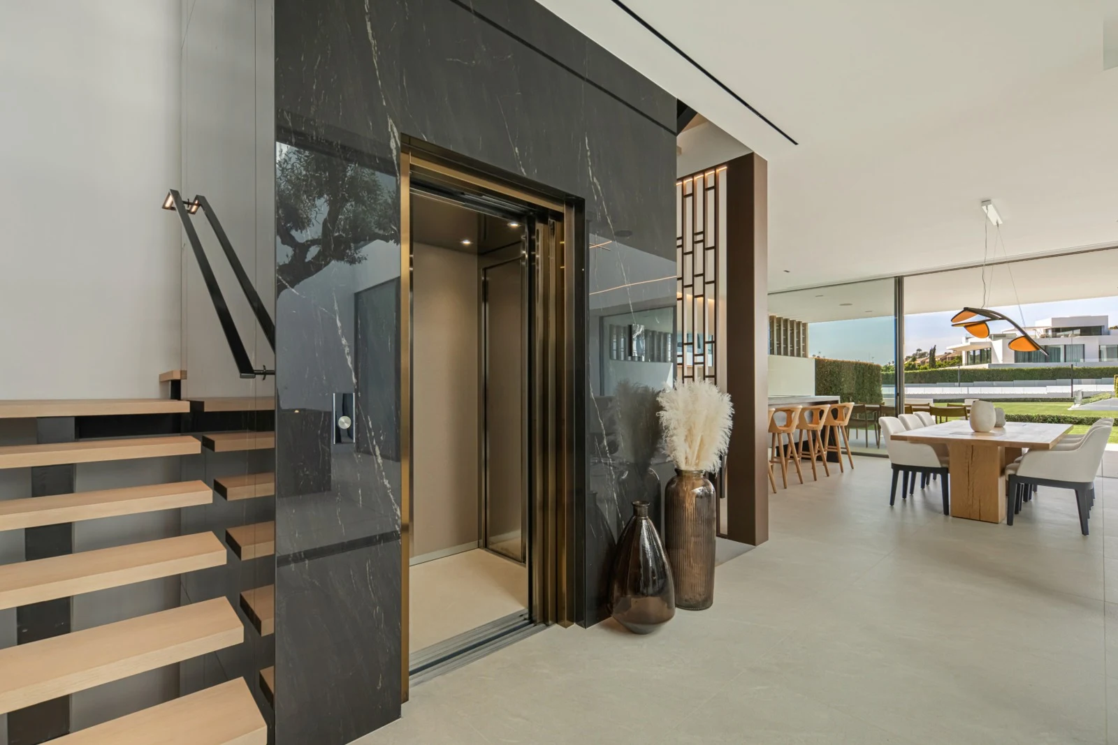 Private lift beside the staircase