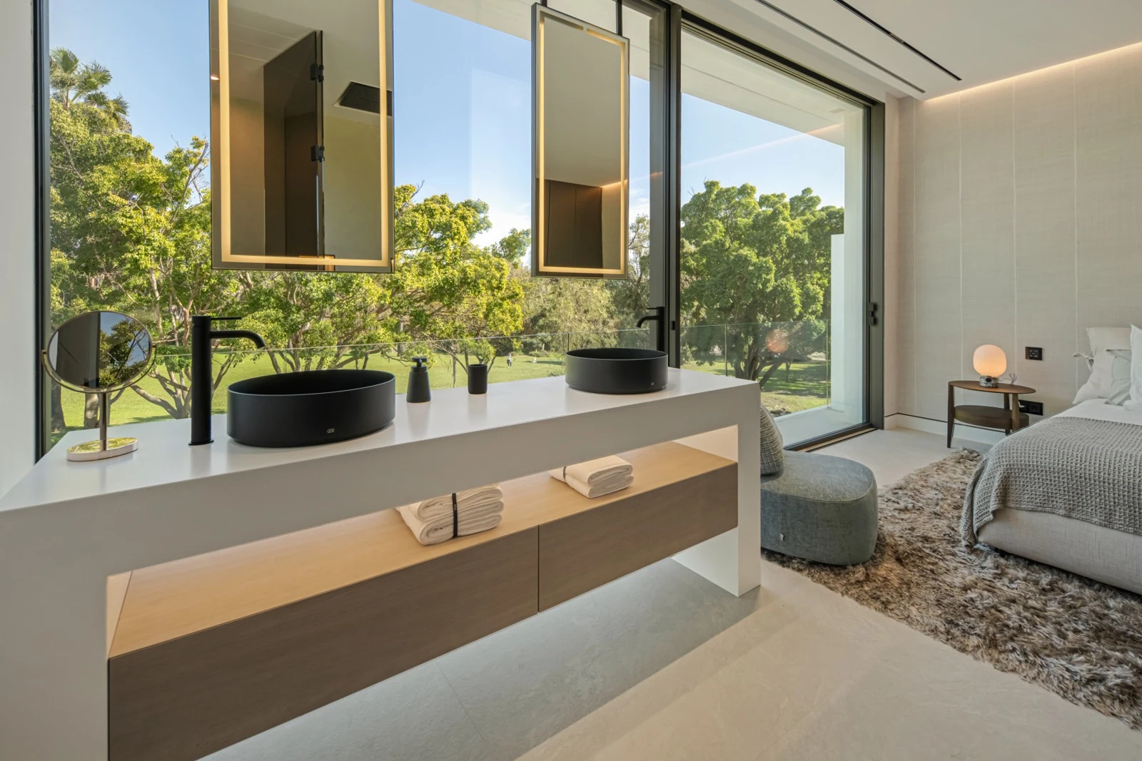 Bathroom vanity beside a large window