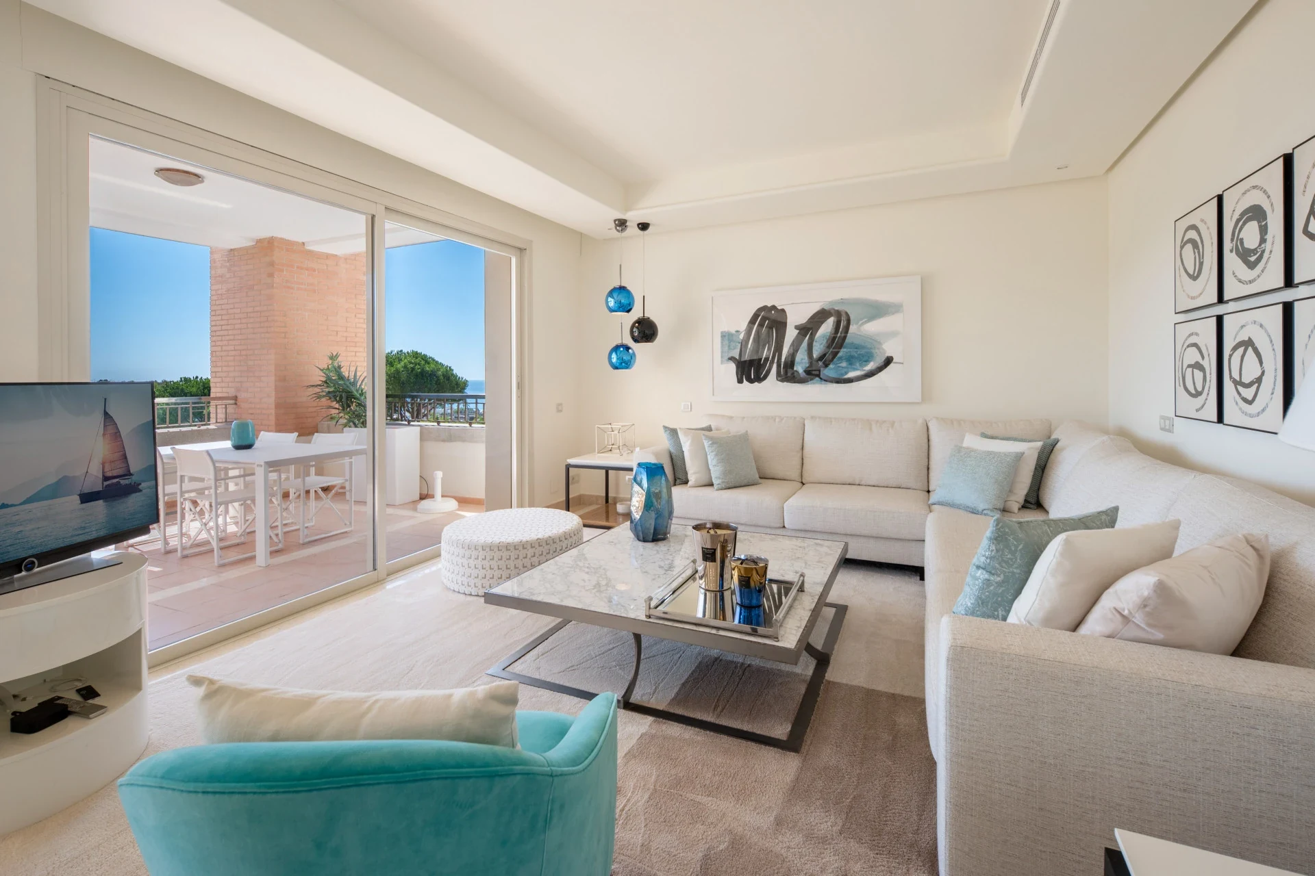 Bright living room opening onto the private terrace