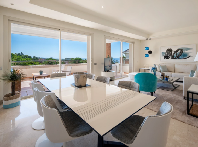 Dining area with large windows and terrace access