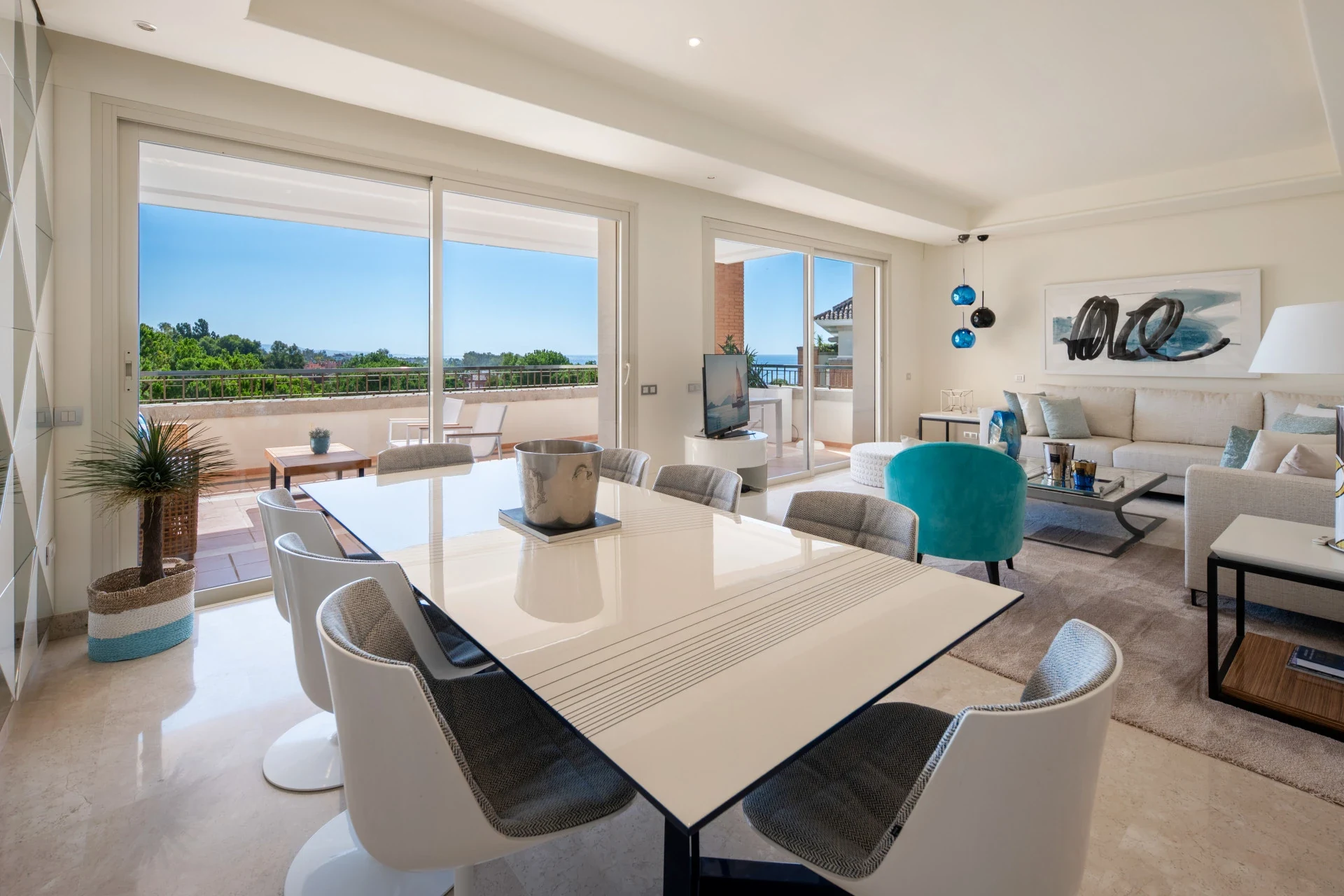 Dining area with large windows and terrace access