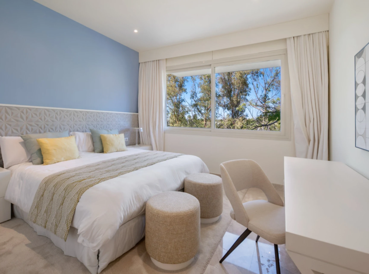 Third bedroom with blue feature wall