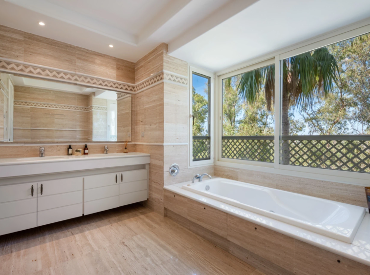 Marble bathroom with bath and double vanity